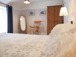 Postel nebo postele na pokoji v ubytování Meredith Cottage + 7 fotografií