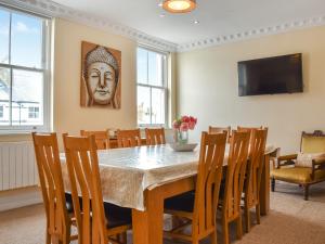 a dining room with a table and chairs at Denelea - Uk49954 in Scarborough