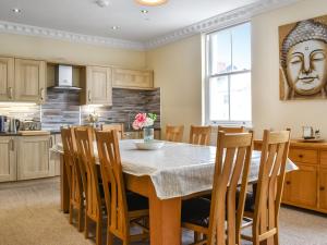 a kitchen and dining room with a table and chairs at Denelea - Uk49954 in Scarborough