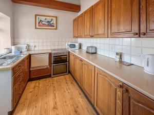 O bucătărie sau chicinetă la Haven Cottage - Uk49651