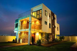 a large building with lights on the side of it at Asa Beach Villa in Trofwi