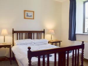 Ένα ή περισσότερα κρεβάτια σε δωμάτιο στο Grisedale Coach House +12 φωτογραφίες