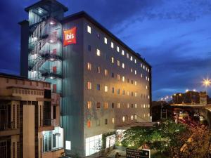 a building with a bbc sign on the side of it at Ibis Bandung Pasteur in Bandung