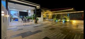 an empty courtyard of a house at night at 181 Homestay Pontian in Kampong Atap