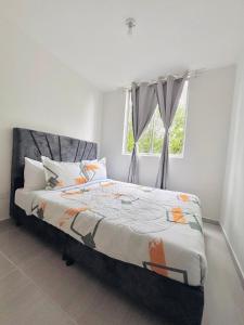 Postel nebo postele na pokoji v ubytování Apartamento en Ibagué 204 - Cantón militar Jaime Rooke