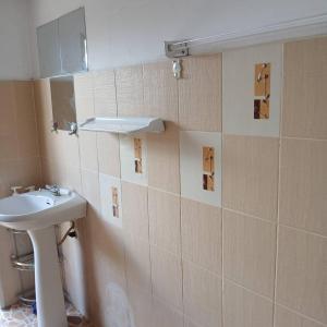 a bathroom with a sink and a mirror on the wall at บ้านอนัตตา in Ban Thung Kwang +32 photos