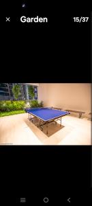 a ping pong table sitting on top of a patio at Eaton kl,2R1B 0Service,klcc,500mbps,2-4pax in Kuala Lumpur