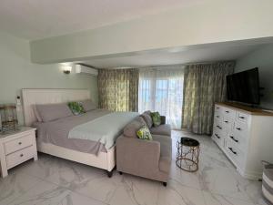 Postel nebo postele na pokoji v ubytování Beach Condo