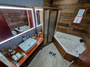 an overhead view of a bathroom with a tub and sink at Arauca Lodge in Villa Ventana +71 photos