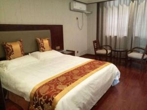 Postel nebo postele na pokoji v ubytování Shell Hotel Wuxi Jiangyin Zhutang Town