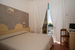 Una habitación en Hotel Conchiglia