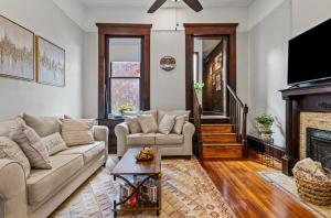 a living room with two couches and a fireplace at MI CASA in Frankfort