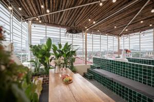 a large room with a duck and plants in it at The Amber Lotus Hanoi-Elegant Stay with Rooftop Pool & Free Pickup-Near Old Quarter in Hanoi