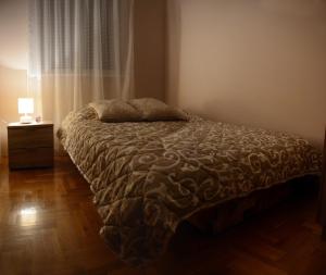 Ένα ή περισσότερα κρεβάτια σε δωμάτιο στο Love Apartment