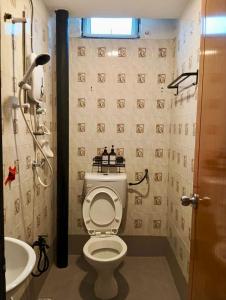 a bathroom with a toilet and a sink at Andiana Hotel & Lodge - Kota Bharu City Centre in Kota Bharu