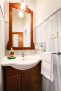 a bathroom with a sink and a mirror at Casa Nonna Netta in Sorrento