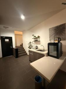 a kitchen with a sink and a counter top at Ayer Keroh Gateway in Ayer Keroh