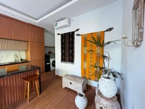 a kitchen with a potted plant in a room at Ningmas Casita Residence Villa by Sidhi Experiences in Ubud