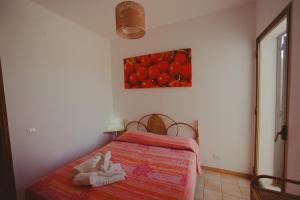 A bed or beds in a room at SanvitoTour - Le Terrazze