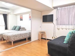 Giường trong phòng chung tại A Stay in Shinjuku