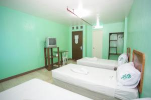 Krevet ili kreveti u jedinici u okviru objekta GV Hotel - Dipolog