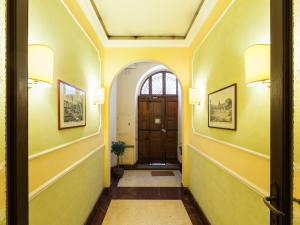 
a hallway with two doors leading to different rooms at Residenza Maritti ContemporarySuite in Rome
