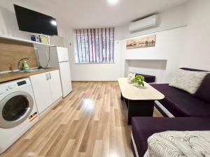 a small living room with a couch and a table at Ruse Charm Studio 3 in Ruse