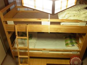 Postel nebo postele na pokoji v ubytování Guesthouse Shirahama + 15 fotografií