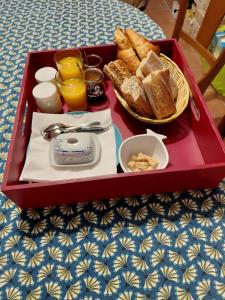 a tray of food with bread and toast on a table at Donemat in Arzon +6 photos