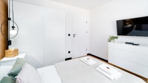 Ένα ή περισσότερα κρεβάτια σε δωμάτιο στο Apartament Piastowski 21