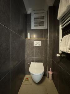 a bathroom with a white toilet in a room at Pine Suit in Çamlıhemşin +30 photos