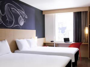 Postel nebo postele na pokoji v ubytování Ibis Mexico Alameda