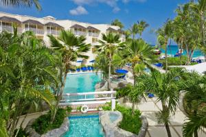 an aerial view of a resort with a pool and palm trees at Turtle Beach, Barbados, A Tribute Portfolio All-Inclusive Resort in Christ Church