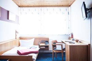 TV a/nebo společenská místnost v ubytování City Hotel Hanau