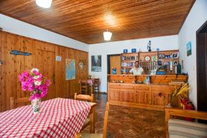 a room with a table with a vase of flowers at Dolphin Apartments in Frangokastello