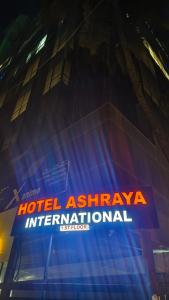 a hotel ashtarhtar international sign on the side of a building at Hotel Ashraya International in Mumbai