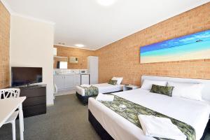 Postel nebo postele na pokoji v ubytování Cranbourne Motor Inn