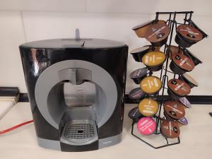 a toaster sitting on a counter next to a bunch of chocolates at Chalet entero en La Rioja in Briones