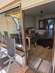 a view of a living room with a bed and a table at Garten EG Wohnung mit 3 Schlafzimmern 95qm in Karlsfeld +3 photos