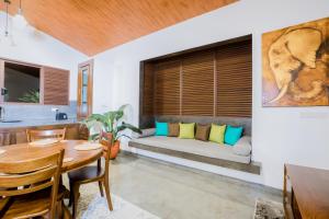 a living room with a couch and a table at 701 Mawella Villa in Mawella
