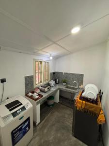 a kitchen with a counter and a stove in it at New mahi mahi villa in Dickwella