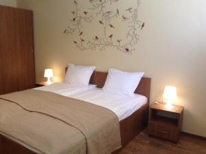 A bed or beds in a room at Apartment Sredetz