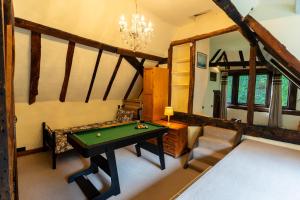 a billiard room with a pool table in it at 600 Year Old Toddbrook Barn Sleeps 11 in Great Parndon