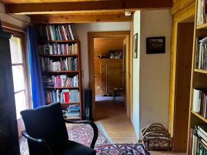 a room with a hallway filled with book shelves filled with books at Patzberg Liesl in Dorfgastein