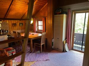 a kitchen and dining room with a table and a window at Patzberg Liesl in Dorfgastein