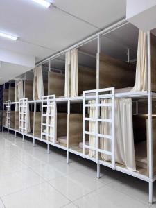 a row of bunk beds in a room at UB NEST-guest house in Ulaanbaatar