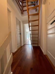 an empty hallway with stairs in a house at Huge private house in Amager in Copenhagen