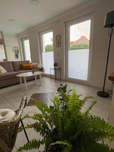 a living room with a couch and a table at Casa mia in Magdeburg