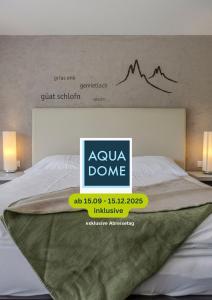 a bed with aania done sign on top of it at Hotel Bergwelt in Längenfeld