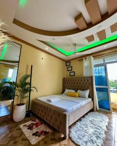 a bedroom with a large bed in a room at HERITAGE LUXURY HOMEs in Kilifi